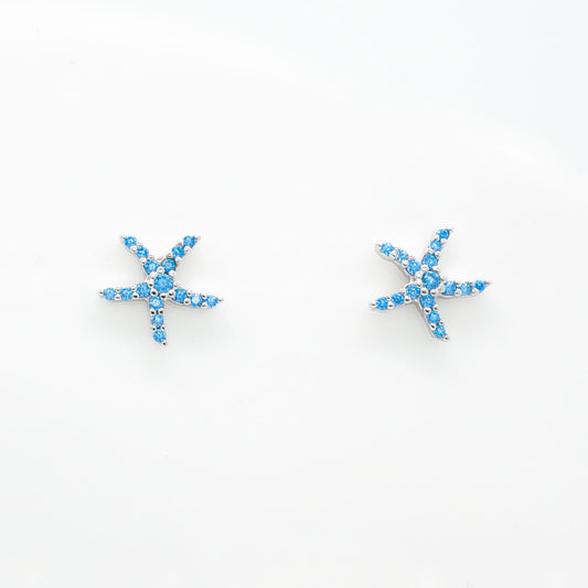 A pair of starfish-shaped stud earrings set with bright blue topaz gemstones, 925 sterling silver, cubic zirconia