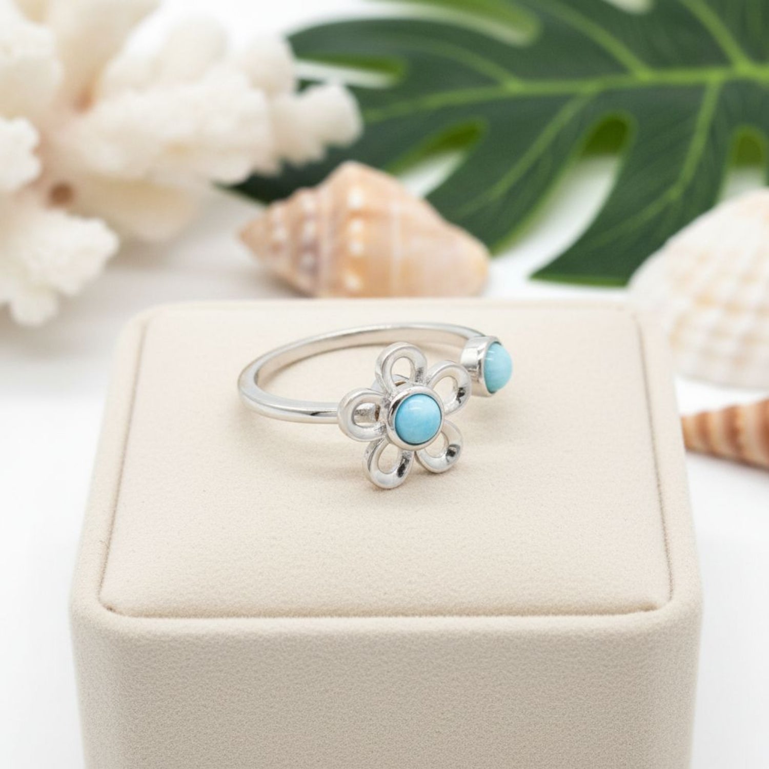 Detail-of-Spinning-Plumeria-Flower-and-Natural-Blue-Larimar-Bypass-Ring-Silver