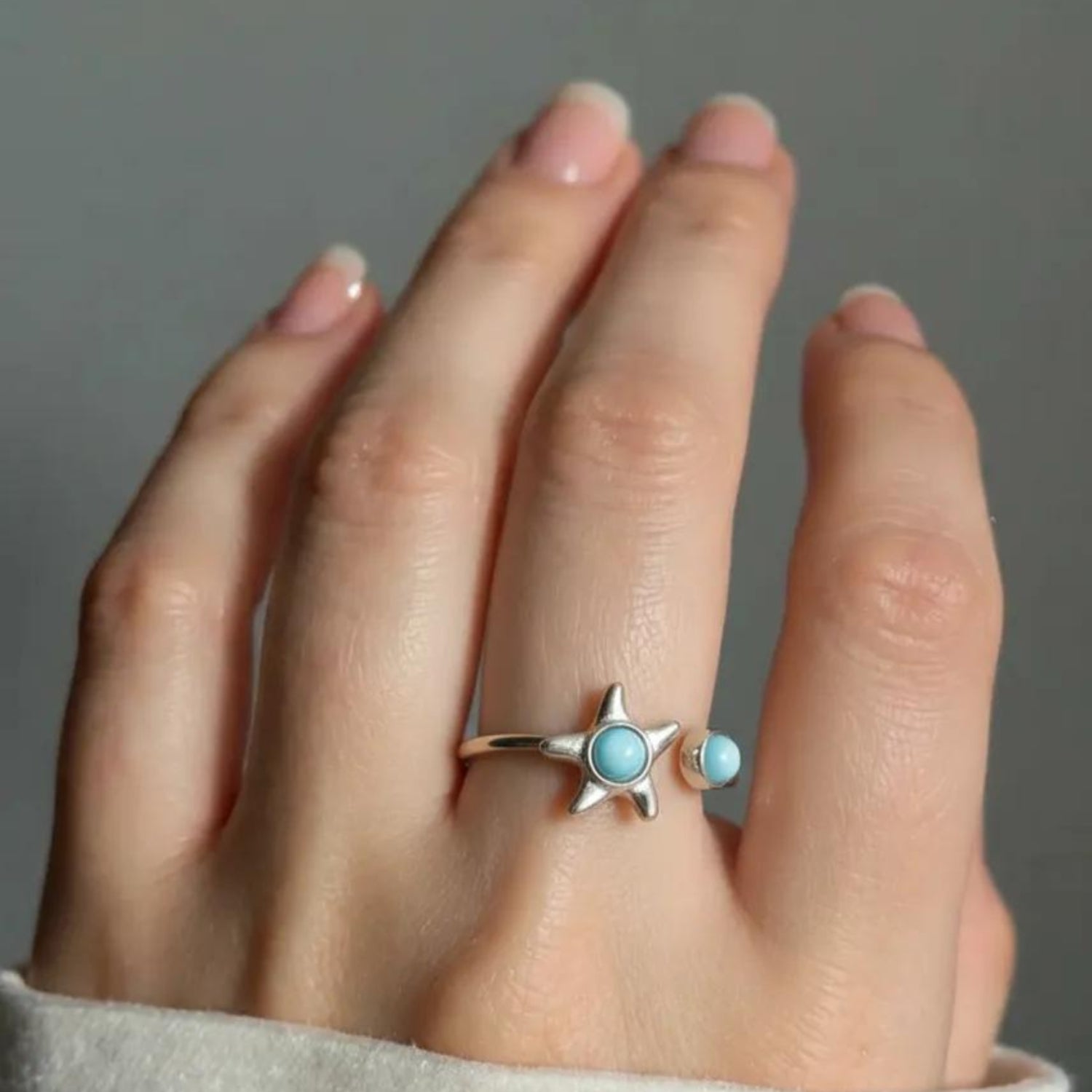 Rotating-Starfish-Spinner-Ring-on-Hand-Larimar-Gemstone-Stress-Relief-Jewelry